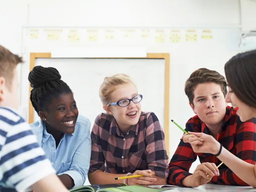Students talking together at a table